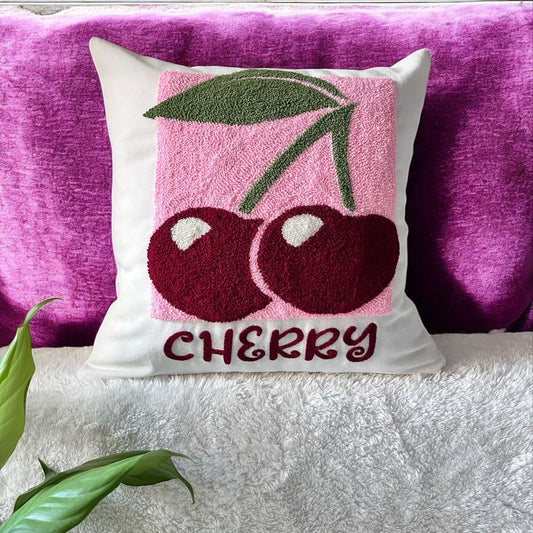 Decorative pillow with cherry design on a pink background
Cherry motif tufted cotton cushion cover with pink background design