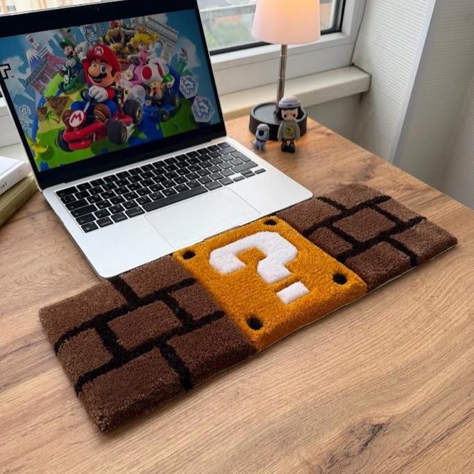 Cozy Bear Super Mario pixel block keyboard rug close up
