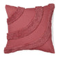 Pink pillow with textured trim on a white background