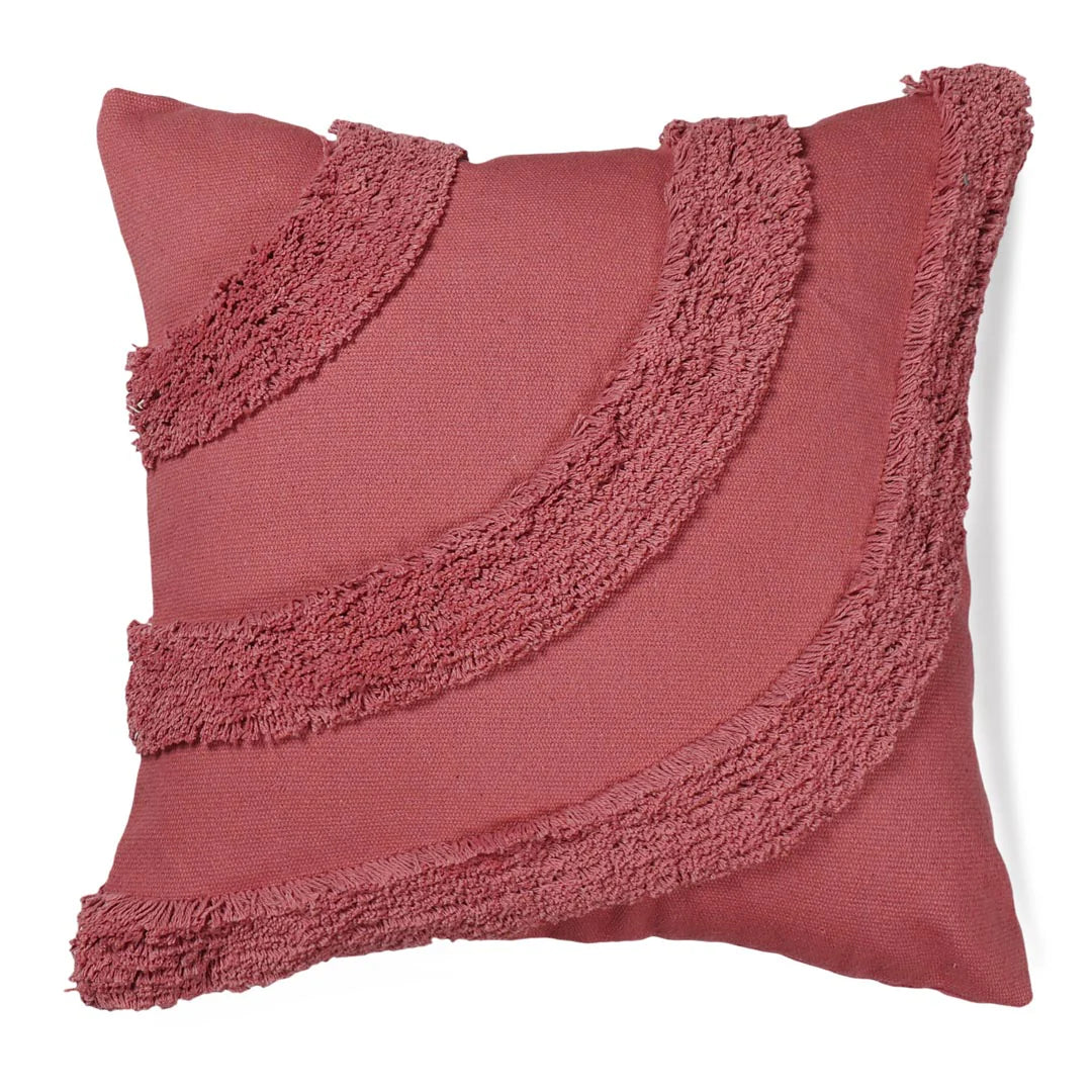 Pink pillow with textured trim on a white background