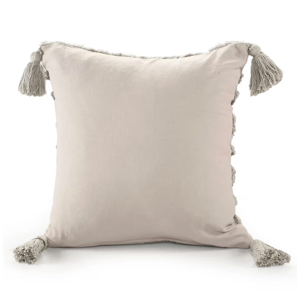 Beige pillow with tassels on a white background
